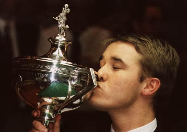 Stephen Hendry celebrates winning one of his seven world snooker titles.