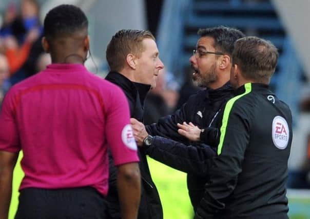 Leeds United head coach Garry Monk, left, and Huddersfield Town counterpart David Wagner clashed last week but are in agreement over their respective aims this weekend.