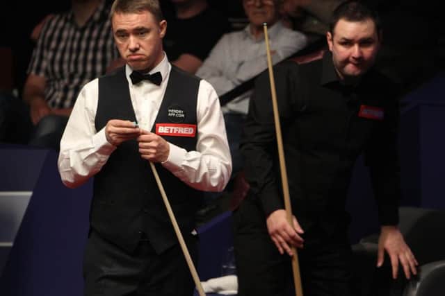 Scotland's Stephen Hendry (left) at the table during his game with Scotland's Stephen Maguire during the Betfred.com World Snooker Championships at the Crucible Theatre, Sheffield, in 2012.