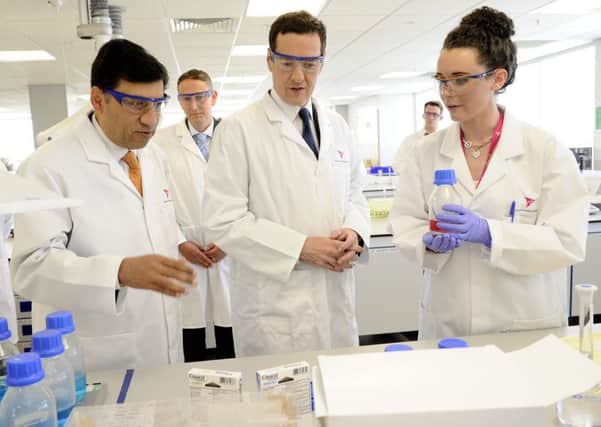 Reckitt chief executive Rakesh Kapoor (left) with then Chancellor George Osborne and Rosanna Laycock in its labratory in Hull, in 2014.  Picture: Jack Harland