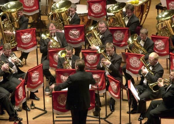 4/3/01      Under the spotlights .....Grimethorpe Colliery Band perform at the  Yorkshire Regional Championships part of the National Brass Band  Championships of Great Britain  at  St George's Hall in Bradford yesterday(sun).