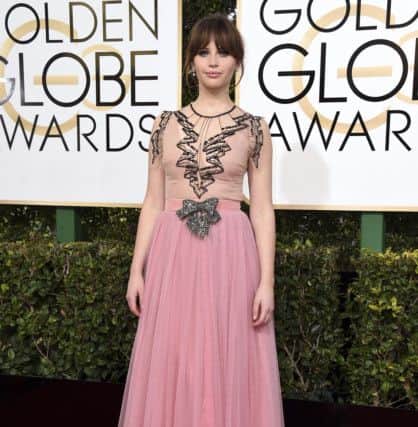 ALL THE PINKS: Felicity Jones at The Golden Globes in Gucci. Pink in all its glorious shades is this spring/summer's essential shade, although soft tones of blush and dusty pink are the most impressive. Nude pink can be awkward to wear but the black here gives definition and counterpoint. Try Phase Eight for soft pink dresses long and short this season. (Photo by Jordan Strauss/Invision/AP)