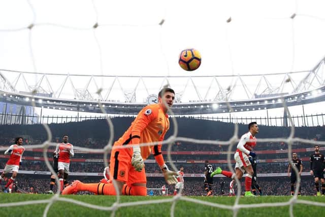 Arsenal's Alexis Sanchez celebrates scoring the second goal.