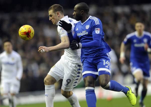 Leeds striker Chris Wood is challenged by former United defender Sol Bamba, now with Cardiff City (Picture: Simon Hulme).