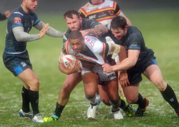 Bradford player Leon Pryce breaks through the Rochdale defence.   Picture by Simon Hulme