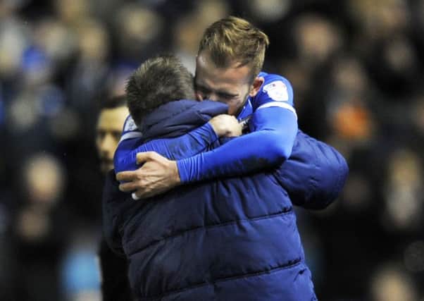 .Jordan Rhodes embraces his father Andy, Sheffield Wednesday's goalkeeping coach, after scoring against Birmingham City (Picture: Steve Ellis).