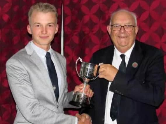 Charlie Thornton, pictured last October receiving the England Golf Boys Order of Merit trophy from Anthony Abraham, Yorkshire Union of Golf Clubs' chairman of selectors.