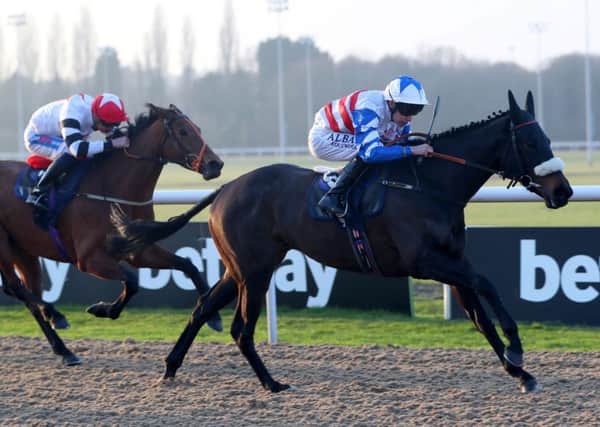 Dream Serenade, right, ridden by Luke Morris, pictured on the way to winning yesterdays Betway Marathon Handicap at Wolverhampton (Picture: Simon Cooper/PA Wire).