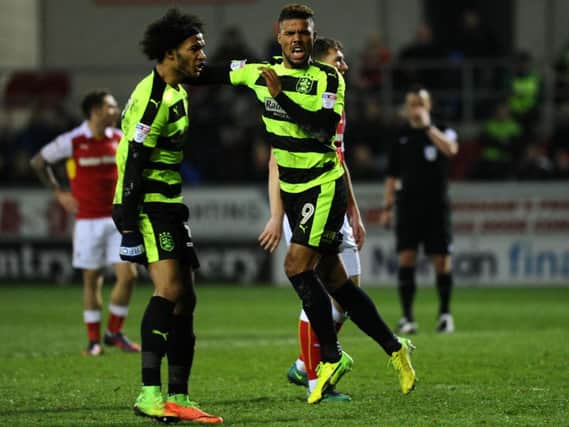 Huddersfield Town's Elias Kachunga celebrates alongside Izzy Brown