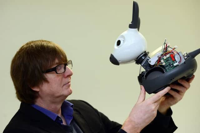 Professor Tony Prescott with MiRo, a pet robot developed in Sheffield. (Scott Merrylees).