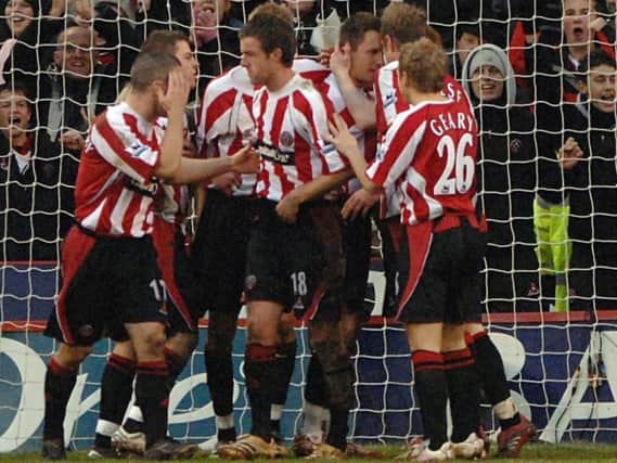 The Blades celebrate after Phil Jagielka scored a second half penalty