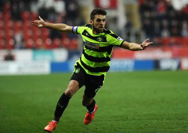 Huddersfield's Tommy Smith celebrates scoring his late winner against Rotherham