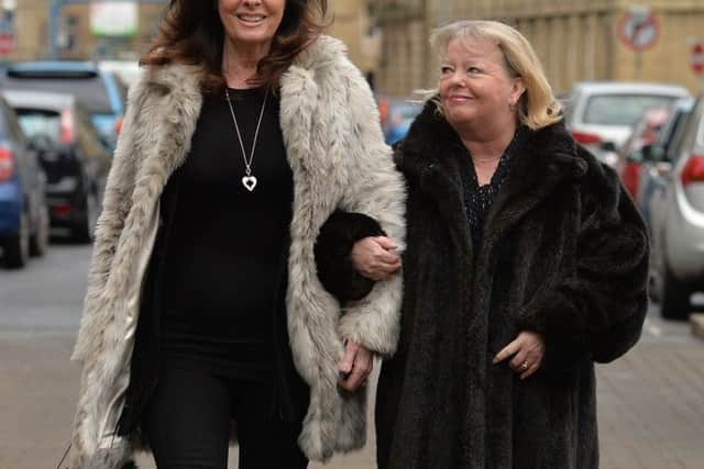 Actresses Vicki Michelle (left) and Sue Hodge arrive for the funeral of 'Allo 'Allo star Gorden Kaye at Huddersfield Parish Church.