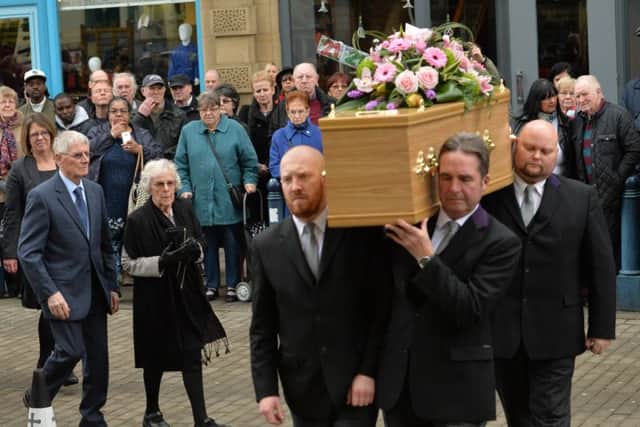 Sheila Shuttleworth, cousin of 'Allo 'Allo star Gorden Kaye follows his coffin as it  is carried into Huddersfield Parish Church for his funeral service.
