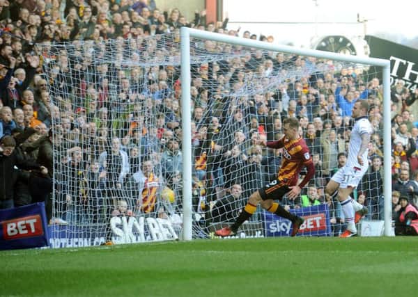 Bradford City's Charlie Wyke prods home  his second goal against Bolton Wanderers (Picture: Tony Johnson).