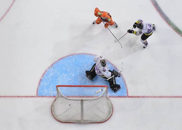 TIPPING POINT: Sheffield Steelers Mathieu Roy gets a touch to deflect the puck past Manchester Storm goalie Mike Clemente for a 3-0 lead on Saturday. Picture: Dean Woolley.