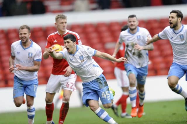 HERO: Fernando Forestieri wheels away to celebrate what proved to be the game-winning goal. Picture: Steve Ellis