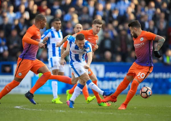 Huddersfield Town's Jack Payne gets an effort in on goal against Manchester City. Picture: Mike Egerton/PA