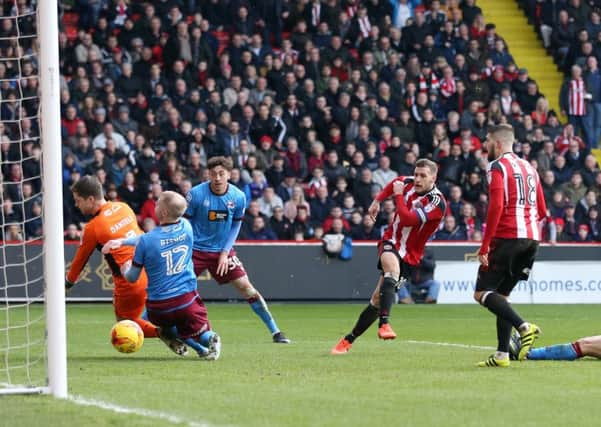 GET IN: Billy Sharpe scoring his side's goal against Scunthorpe at Bramall Lane. Picture: David Klein/Sportimage.