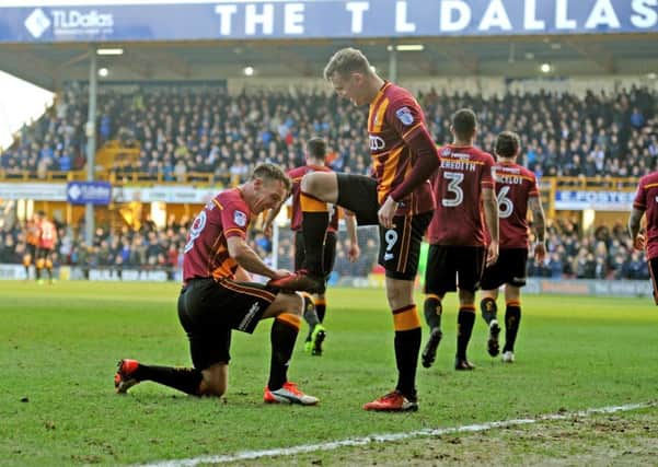OPENING SALVO: Bradford City's Charlie Wyke celebrates his first goal with Tony McMahon. Picture: Tony Johnson.