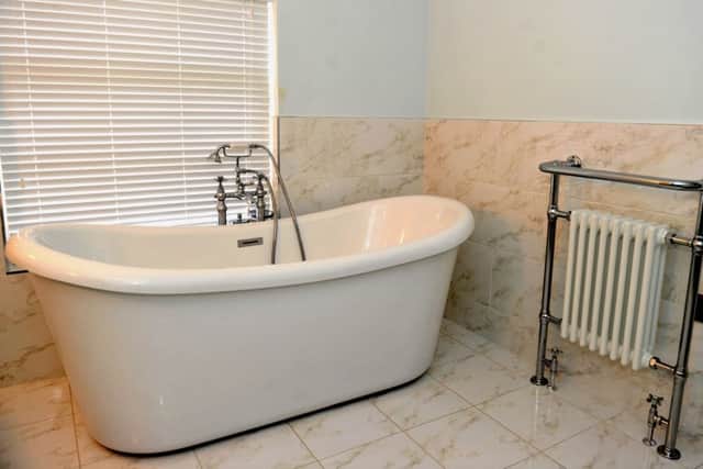 The house bathroom with bath from Soakology and towel rail from Victorian Plumbing