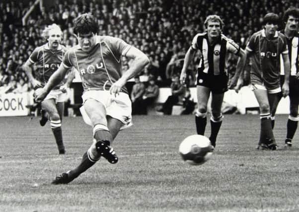 Rotherham United player-boss,  Emlyn Hughes, in action during the 1982-83 season.