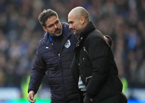 Huddersfield Town manager David Wagner (left) and Manchester City manager Pep Guardiola at the John Smith's Stadium. Picture: Mike Egerton/PAclub/league/player publications.