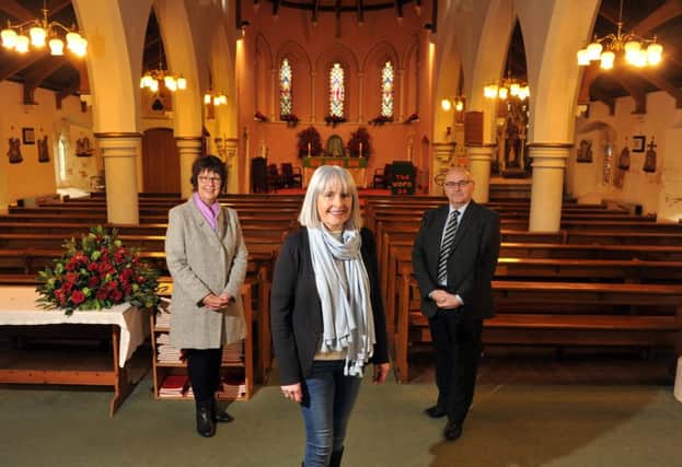 Susannah Melleney, centre, Catherine Murphy and Ian Parkinson are fundraising for the historic church. Picture by Tony Johnson