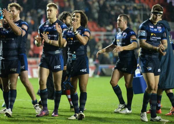 Leeds Rhinos' players applaud the traveling fans after edging out Leigh Centurions last Friday.  Picture: Bruce Rollinson