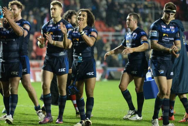 Leeds Rhinos' players applaud the traveling fans after edging out Leigh Centurions last Friday.  Picture: Bruce Rollinson