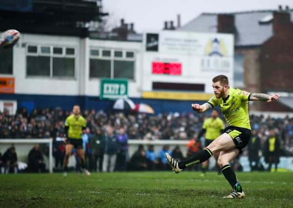 Hull FC's Marc Sneyd kicks for goal earlier this year at Wakefield Trinity. Picture: Alex Whitehead/SWpix.com