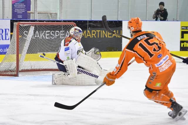 Mathieu Roy scores against Edinburgh at Ice Sheffield last month. Pictures: Dean Woolley.