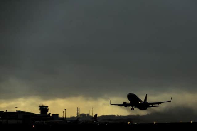 A plane takes off from Leeds Bradford Airport into heavy cloud as flights have been cancelled and commuters were warned they faced delays after Storm Doris reached nearly 90mph on its way to batter Britain. Picture: Danny Lawson/PA Wire