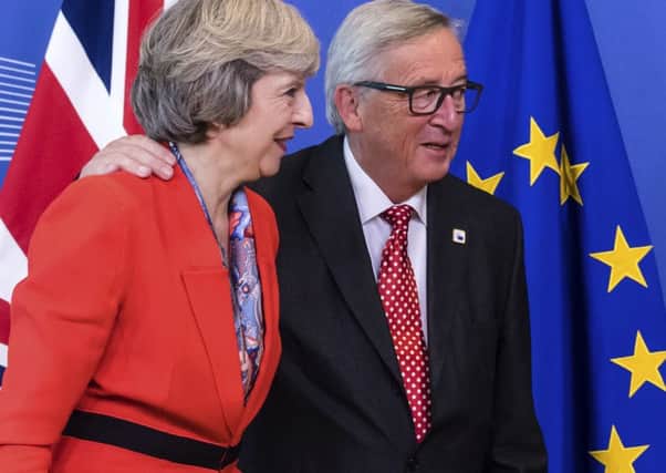 Theresa May with Jean-Claude Juncker.