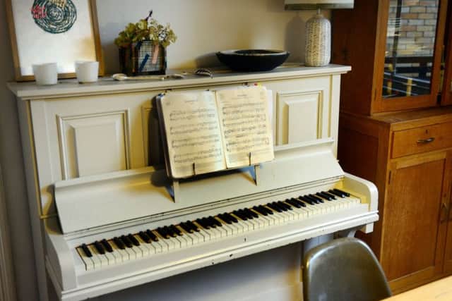 The piano was a gift and has been painted white