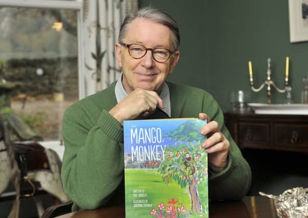 Judge Paul Worsley QC with his first children's book, The Mango Monkey. Picture: Richard Ponter
