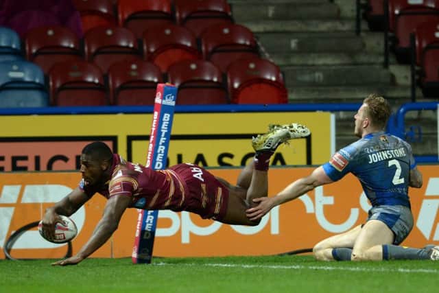 Jermaine McGillvary flies over to score the Giants' fifth try against Wakefield Trinty.  Picture: Bruce Rollinson