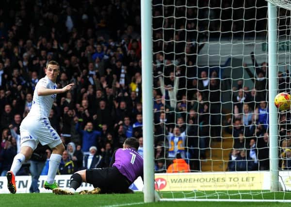 Chris Wood looks across to check that there is no offside flag as he wheels away to celebrate what proved the winning goal for Leeds United against play-off rivals Sheffield Wednesday (Picture: Jonathan Gawthorpe).