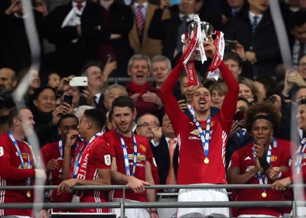 Manchester United's Zlatan Ibrahimovic lifts the trophy after the EFL Cup final at Wembley. He scored twice as United beat Southampton 3-2 (Picture: Nick Potts/PA Wire).