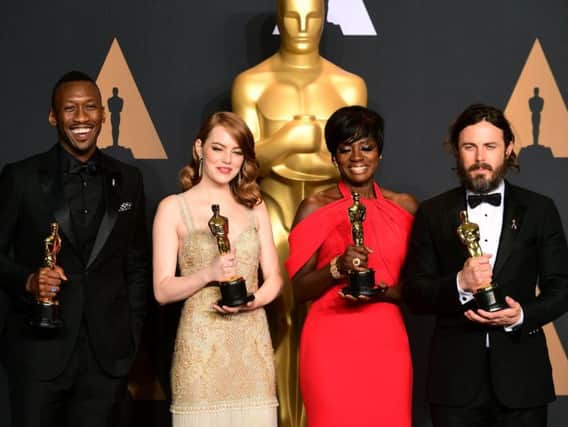 Mahershala Ali with the award for Best Supporting Actor, Emma Stone with the award for Best Actress, Viola Davis with the award for Best Supporting Actress and Casey Affleck with the award for Best Actor in the press room at the 89th Academy Awards.