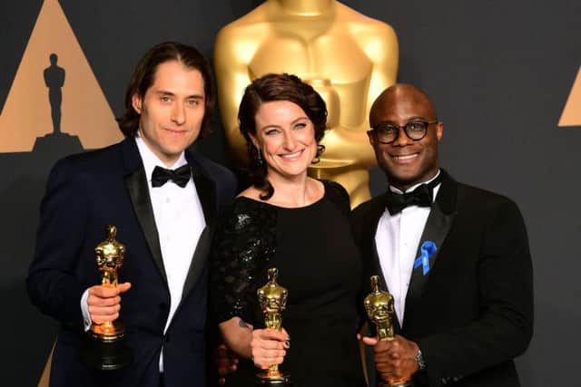 Jeremy Kleiner Adele Romanski, and Barry Jenkins with the award for Best Picture for Moonlight.