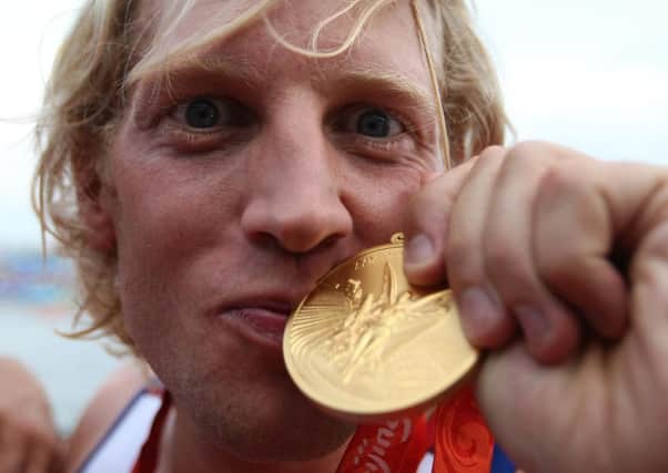 Great Britain's Andrew Triggs Hodge kisses his medal after winning gold during the mens four final at the Shunyi Olympic Rowing-Canoeing Park during the 2008 Beijing Olympic Games, China. It was his first of three Olympic gold medals in a career he has now called time on. (Picture: Andrew Milligan/PA Wire).