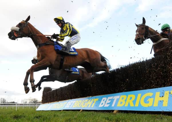 The Last Samuri, seen being ridden by David Bass, clears a fence on their way to winning the BetBright Grimthorpe Chase at Doncaster last year (Picture: Anna Gowthorpe/PA).