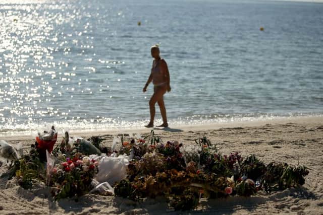 Flowers on the beach near the RIU Imperial Marhaba hotel in Sousse, Tunisia, where 38 people lost their lives