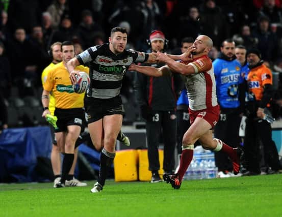 GREAT TALENT: Hull's Jake Connor hands off Catalan's Alrix Da Costa. Picture: Jonathan Gawthorpe