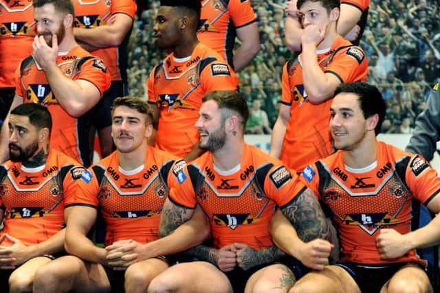 Zak Hardaker joins arms with Greg Minikin and Tom Holmes, during the Castleford Tigers media day in January. Picture: Jonathan Gawthorpe