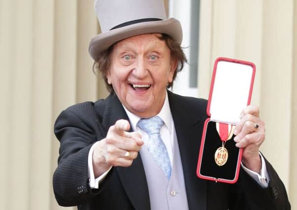 Sir Ken Dodd at Buckingham Palace, London, after he was made a Knight Bachelor of the British Empire by the Duke of Cambridge.