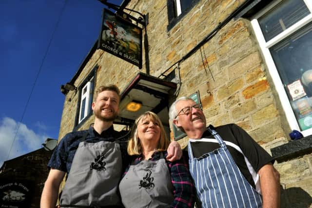 Stuart  Miller (left), Landlord  of the  George and Dragon pub at Hudswell with his mum and dad  Keith and Stephanie Miller, who are also part of the team.