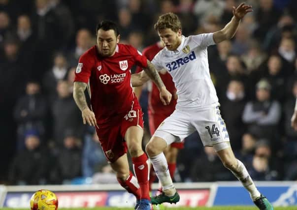 Leeds United's Eunan O'Kane, right, duels with Bristol City's Lee Tomlin at Elland Road last month (Picture: Simon Cooper/PA Wire).