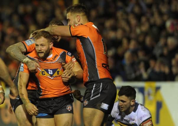 Castleford Tigers celebrate Paul McShane's try in their 66-10 win against Leeds Rhinos (Picture: Steve Riding).